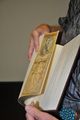 The binding features a double fore-edge painting: here we see an image of L. Frank Baum and the Wond'rous Wise Man